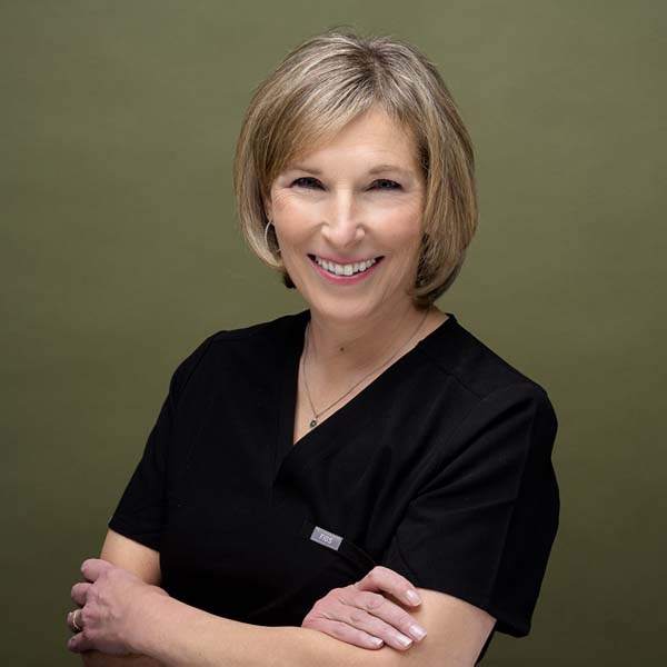Tracy Mignone, Administrative Assistant assisting clients at Placeres Integrative Medicine
